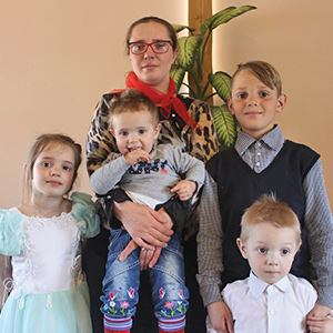 Olga and her children in church