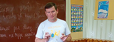 Sergei teaching children at Sunday school.