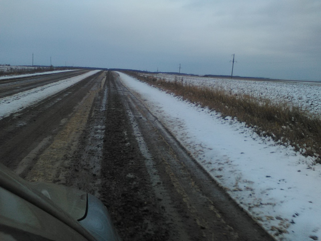 Snowy road in October.