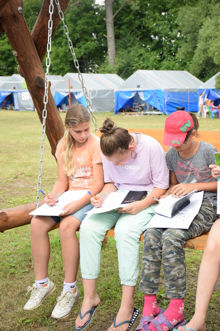 Girls work together on a Bible lesson.