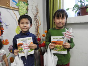 Aital (left) received a star and a Christmas gift during an Immanuel's Child event.