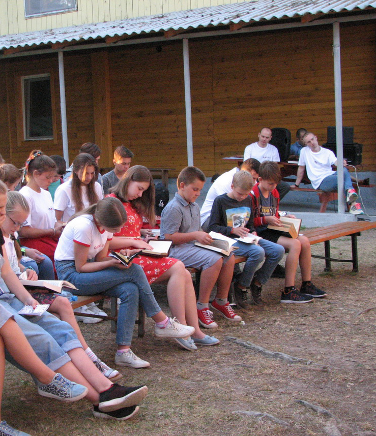 Children study God's Word during a Bible lesson.