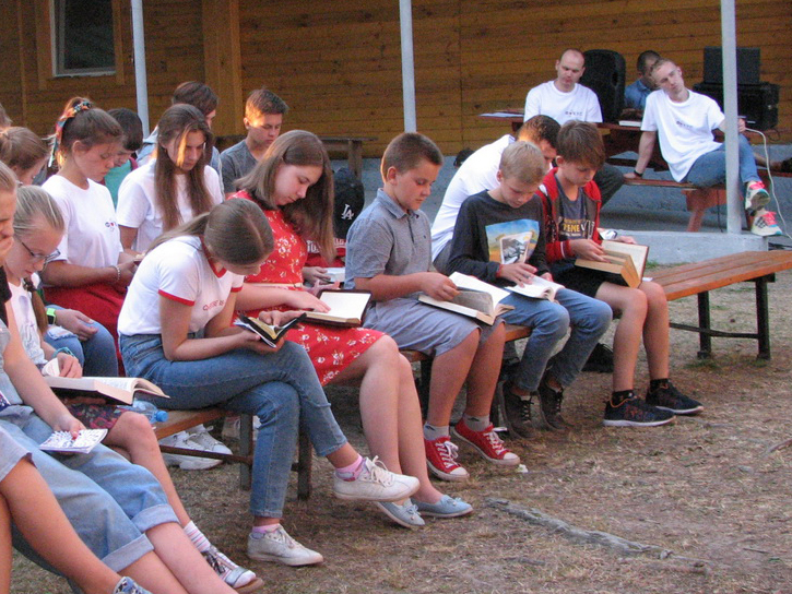 Children study God's Word during a Bible lesson.