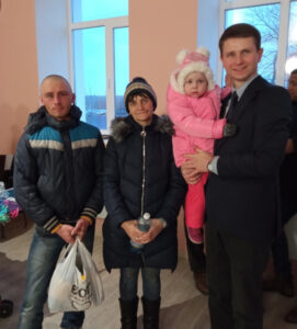 Pastor Andrei with Katerina and her family.