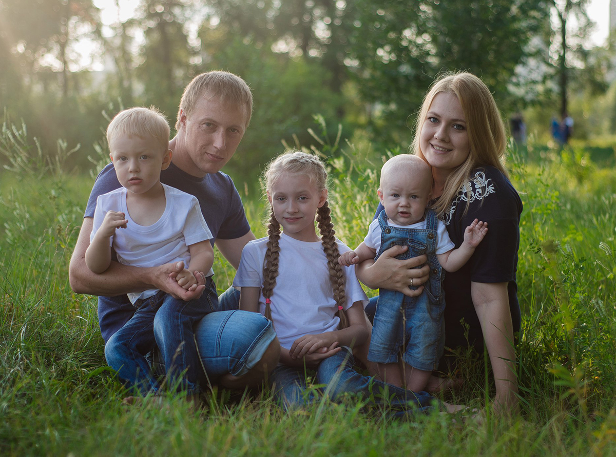 Orphan-graduate Nina and her family.