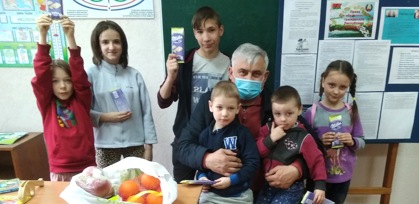 Sergei with Polina and other children in her orphanage.