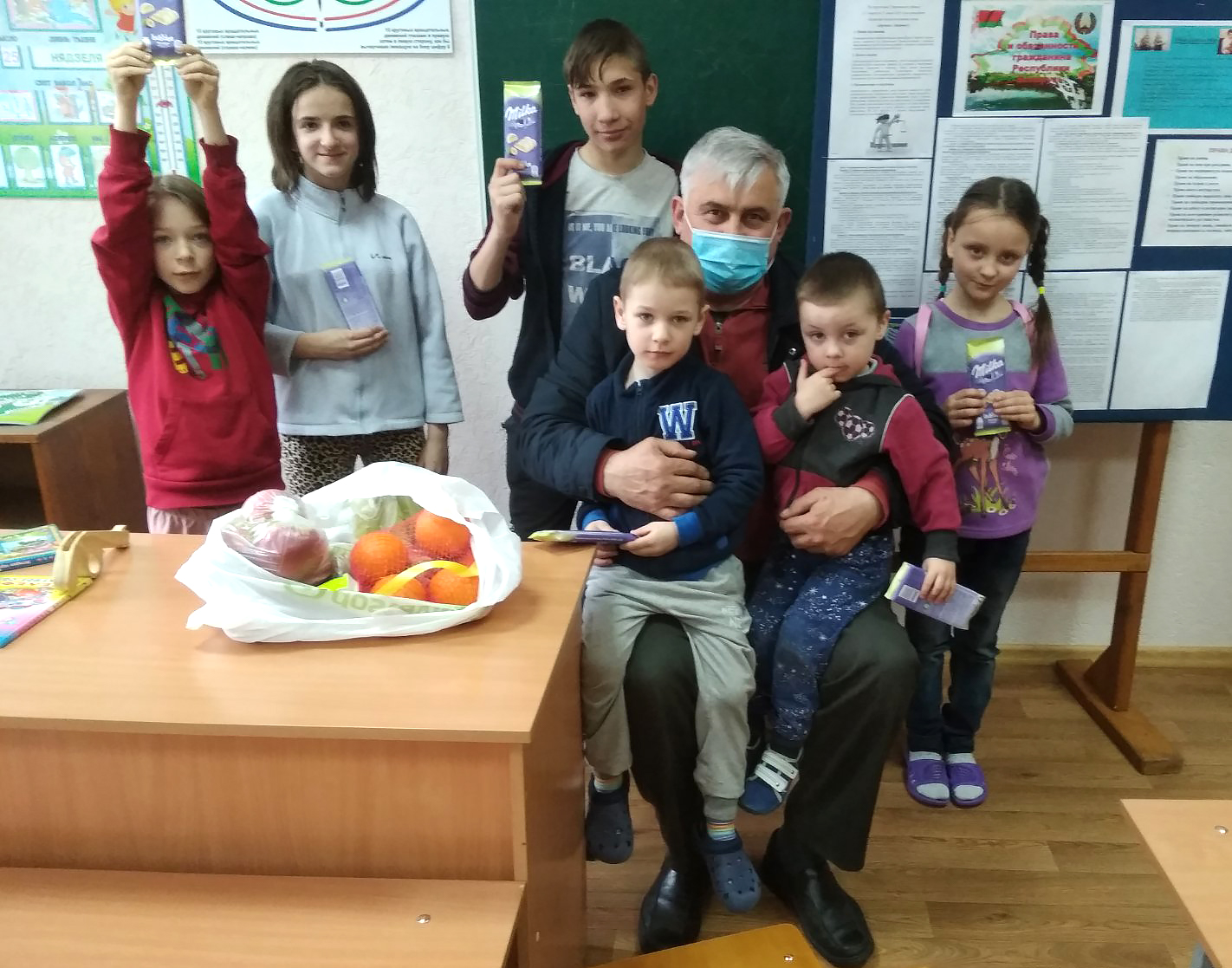 Sergei with Polina and other children in her orphanage.