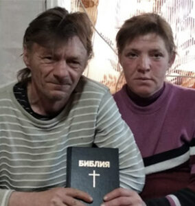 Couple Holding A Bible