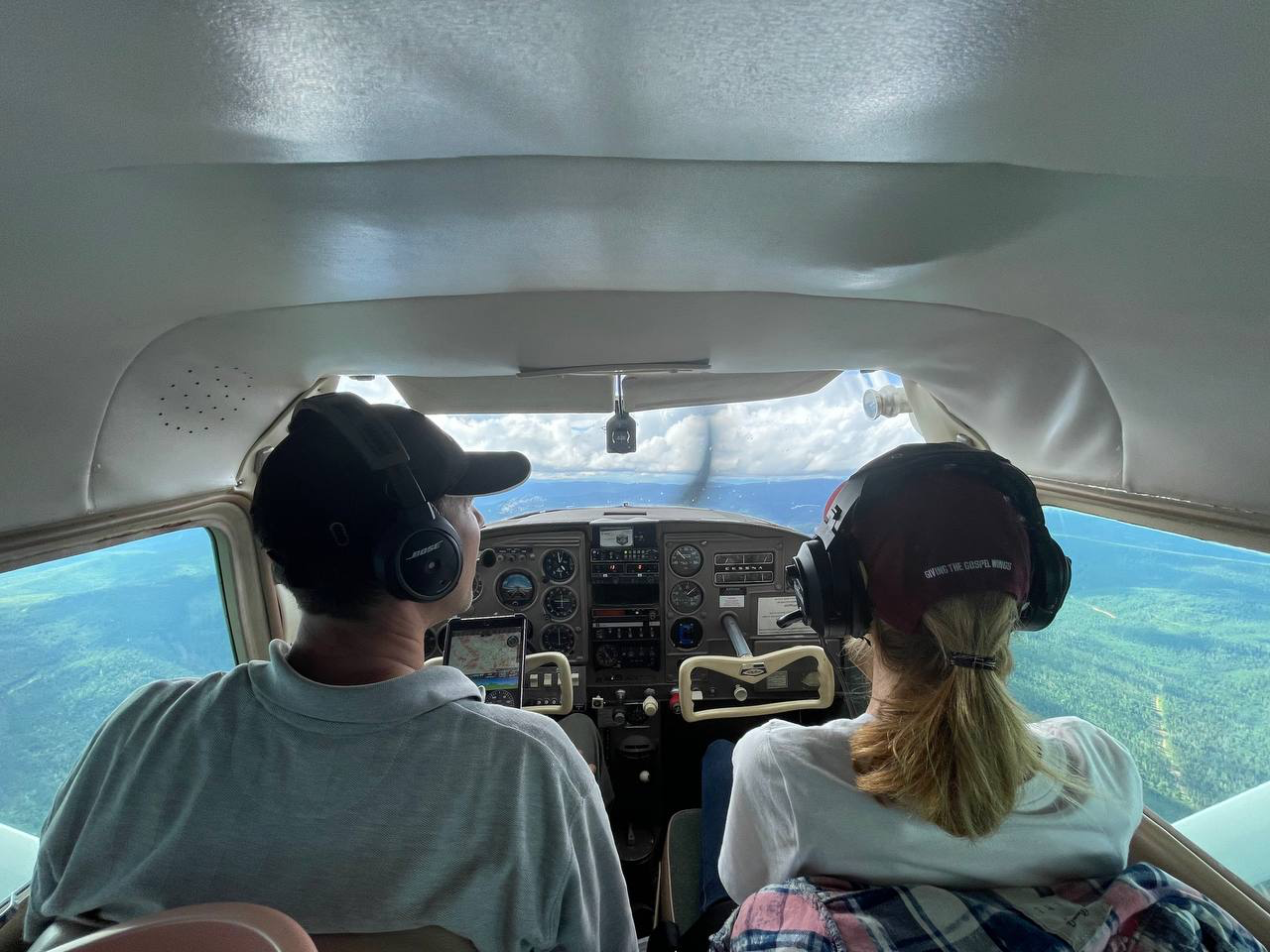 Mikhail and his wife flying to the remote village.