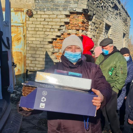 People are grateful to receive winter warmth kits.