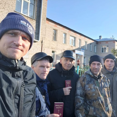 Vasily sharing the Gospel and distributing New Testaments.
