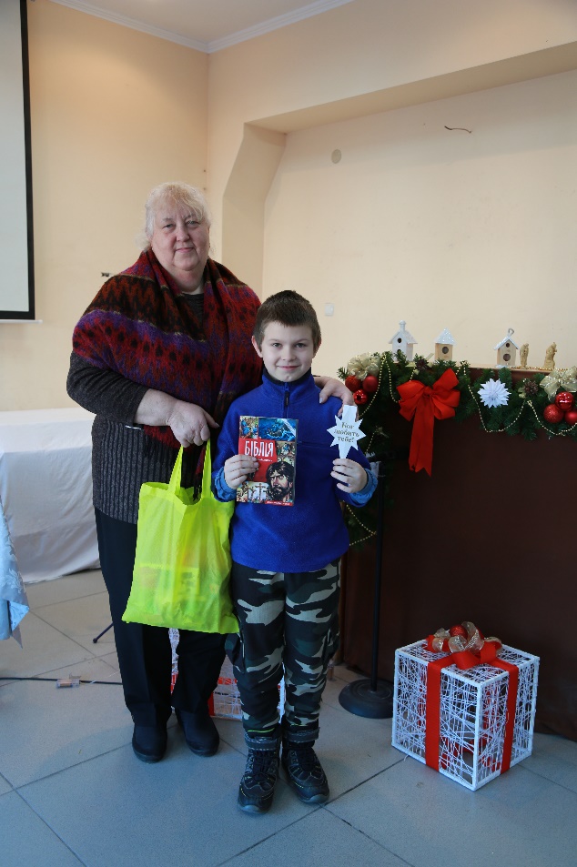 Denis and his grandmother at the Immanuel's Child celebration.