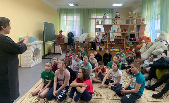 Elena uses paper dolls to teach a lesson in Orphanage 10.