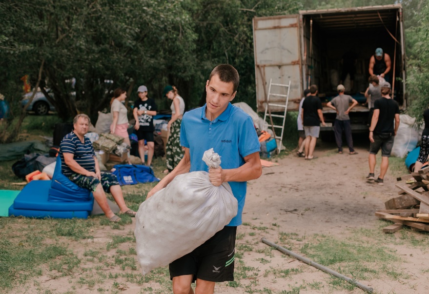 Oleg helps to set up the camp site.