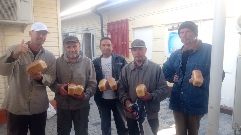 Distributing bread to people in need.