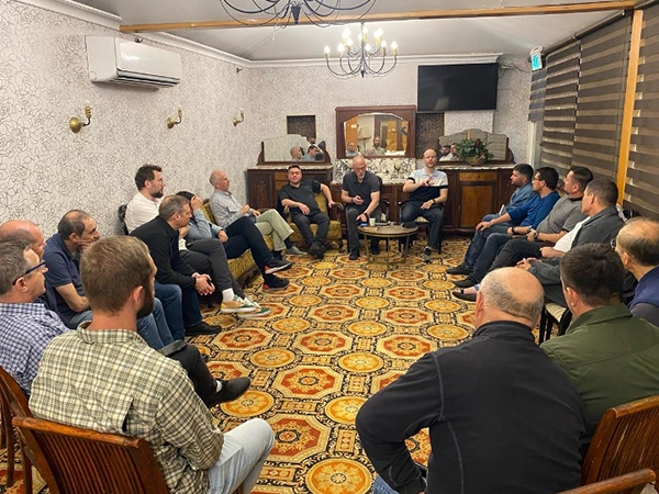 Group of people in a room learning about the true Messiah