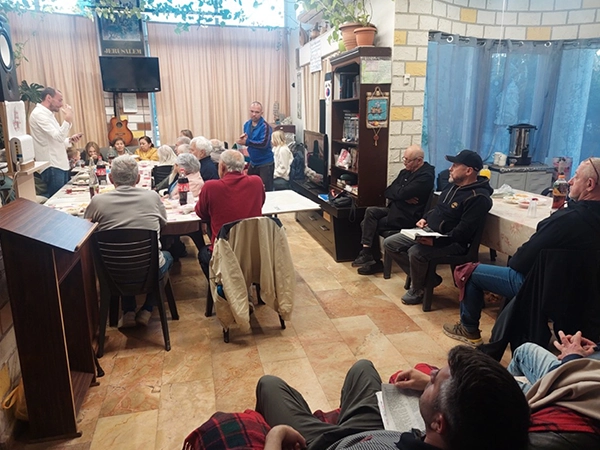 Group meeting in a room about the true Messiah