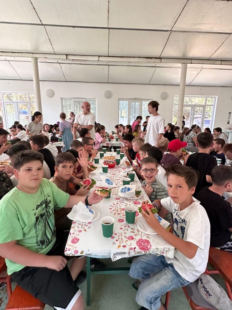 Campers enjoy the sandwiches.