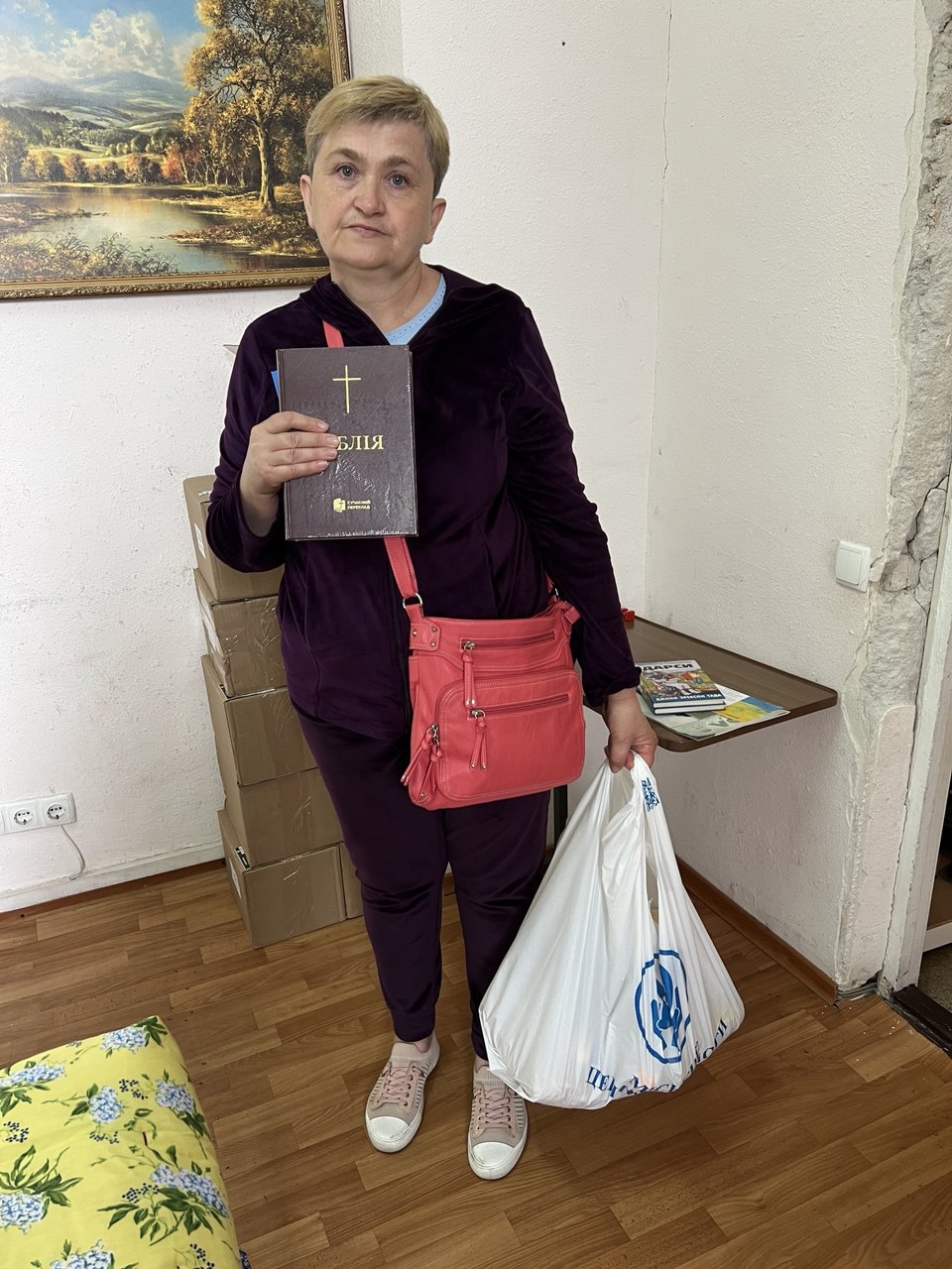 Svetlana with aid and a Bible.
