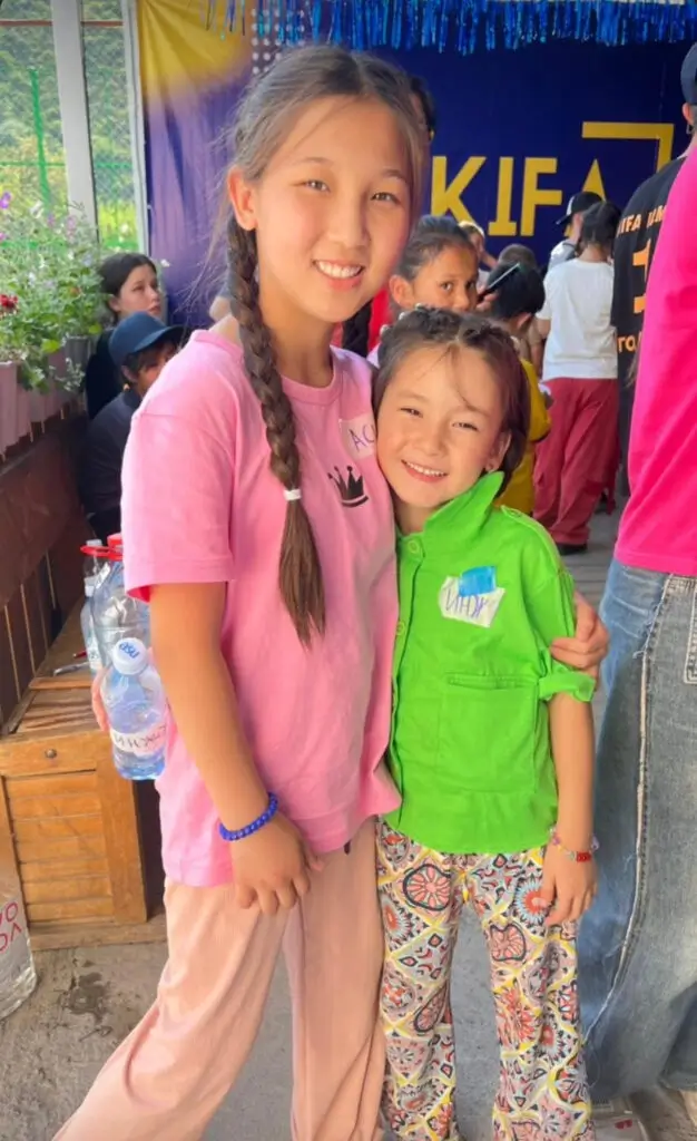 Two children hugging each other