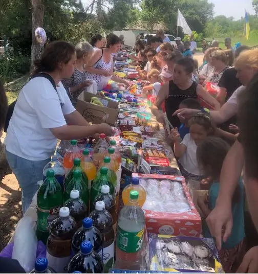 Woman serving food to kids