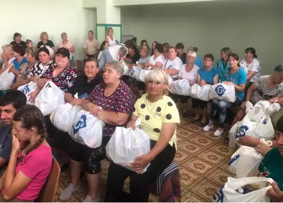 Women holding bags with essential items
