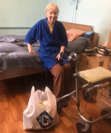 Woman sitting on a bed